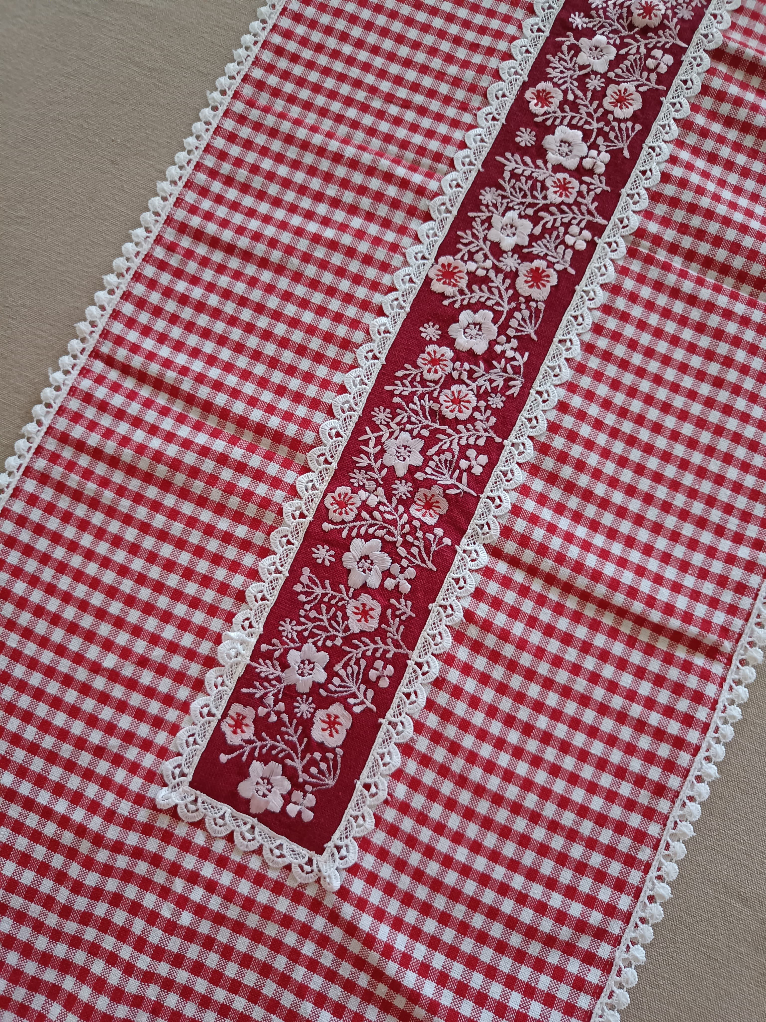 Red floral embroidered table runner with gingham print & lace.