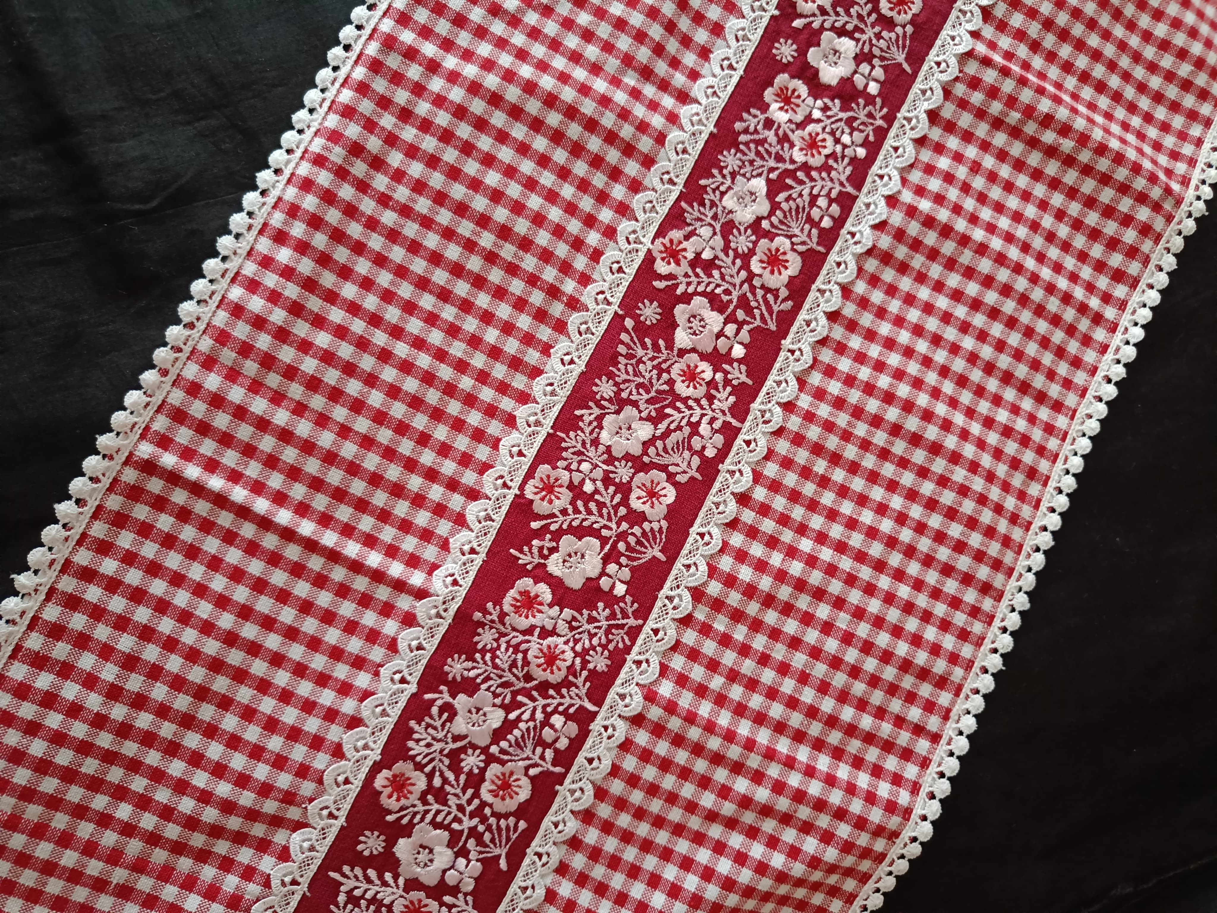 Red floral embroidered table runner with gingham print & lace.