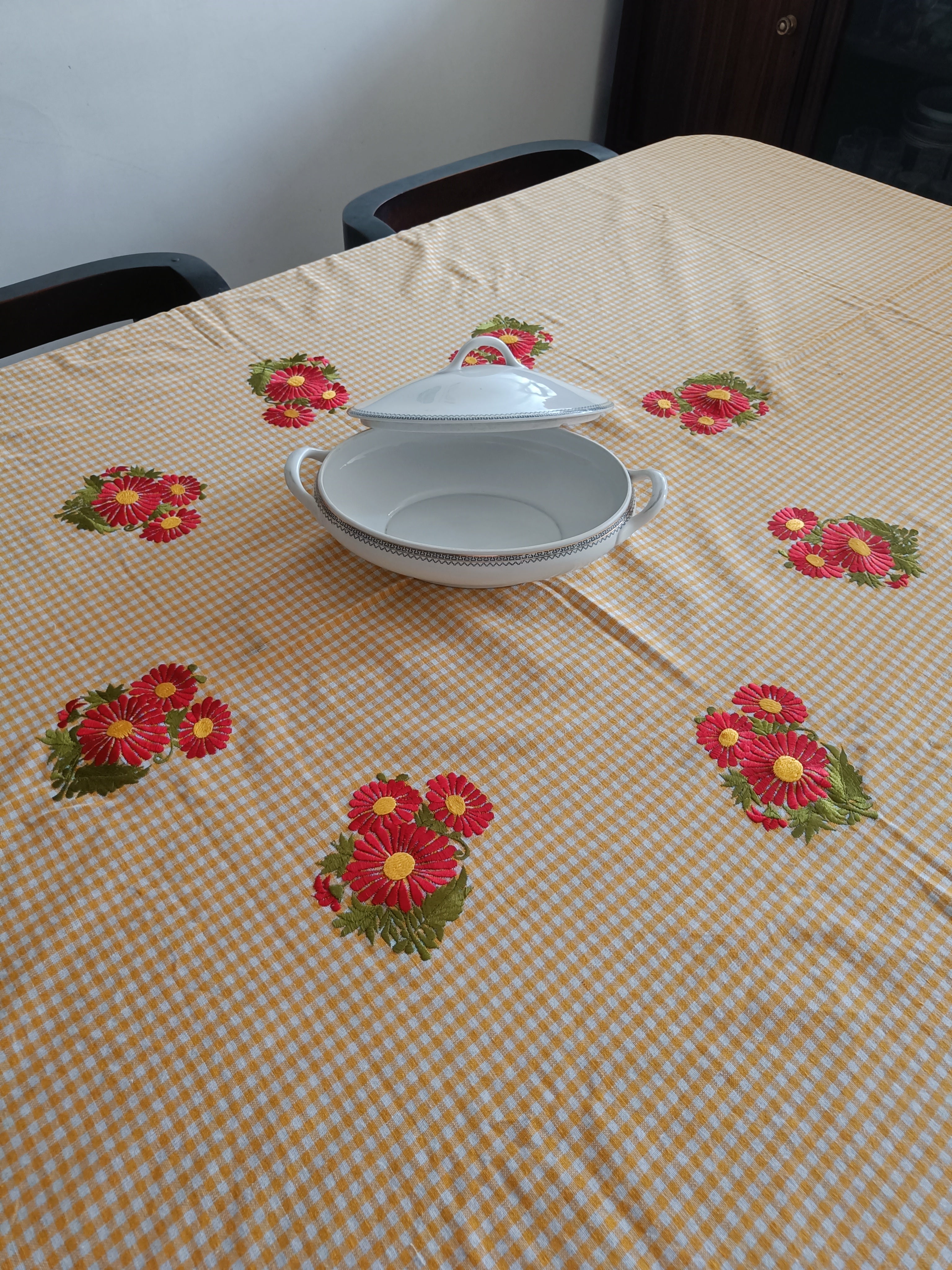 Floral embroidered table cloth in mustard gingham print