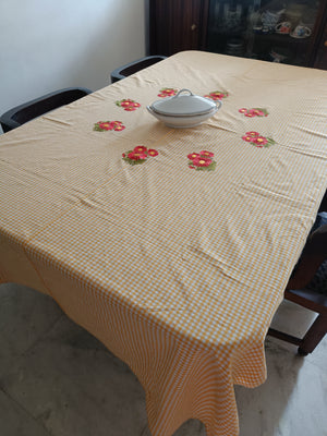 Floral embroidered table cloth in mustard gingham print