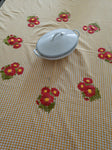 Floral embroidered table cloth in mustard gingham print