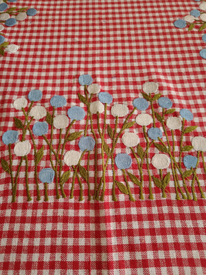 Floral embroidered table cloth in red gingham print