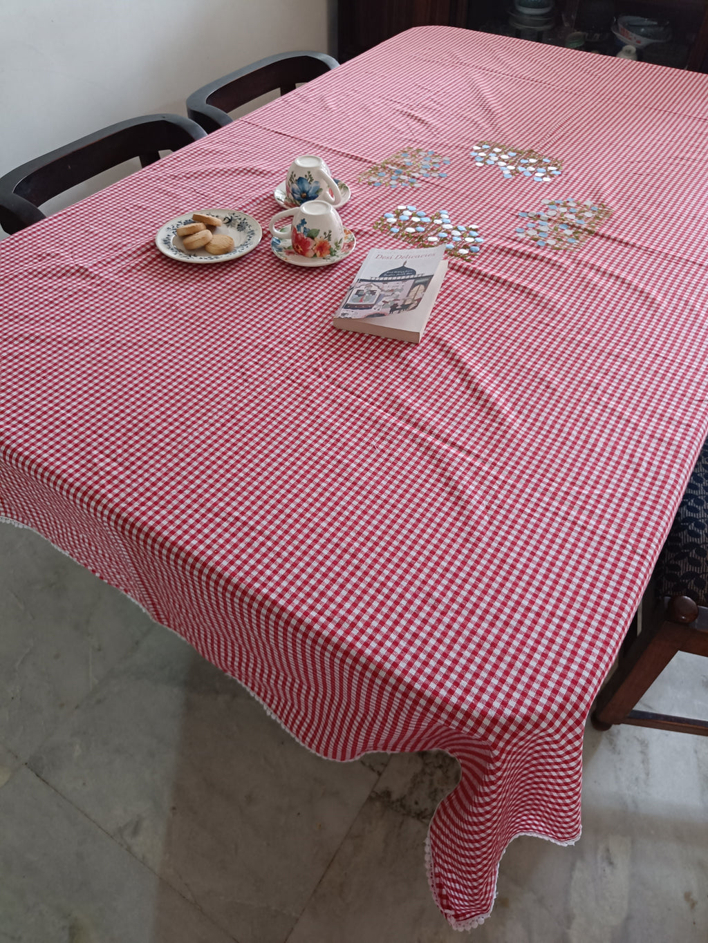 Floral embroidered table cloth in red gingham print