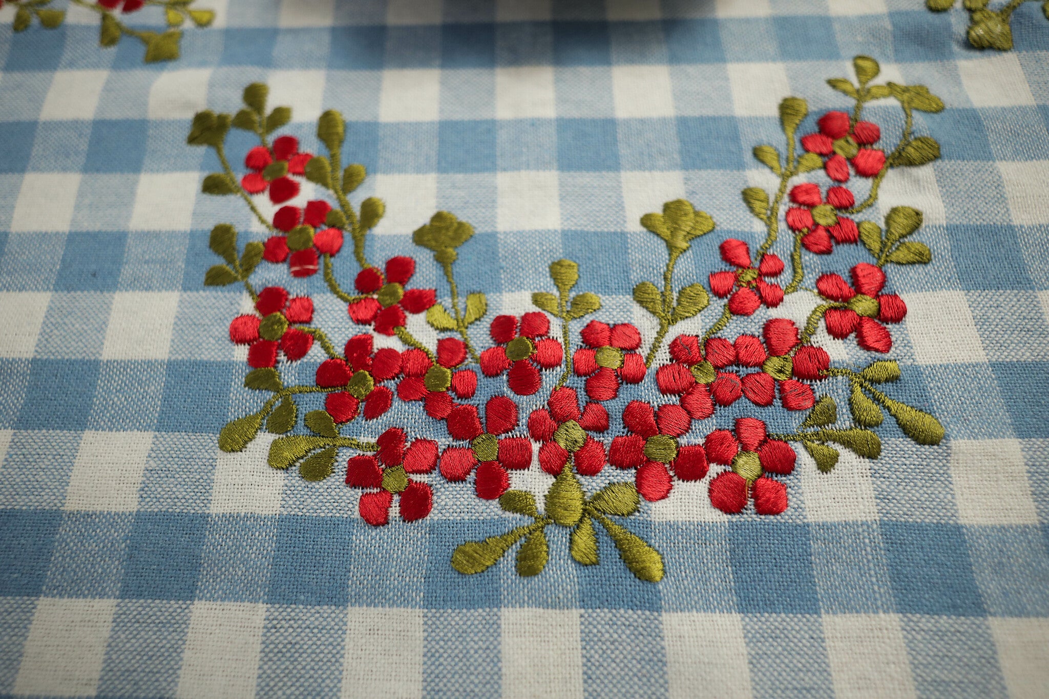Blue Gingham print Table Cloth with red floral embroidery
