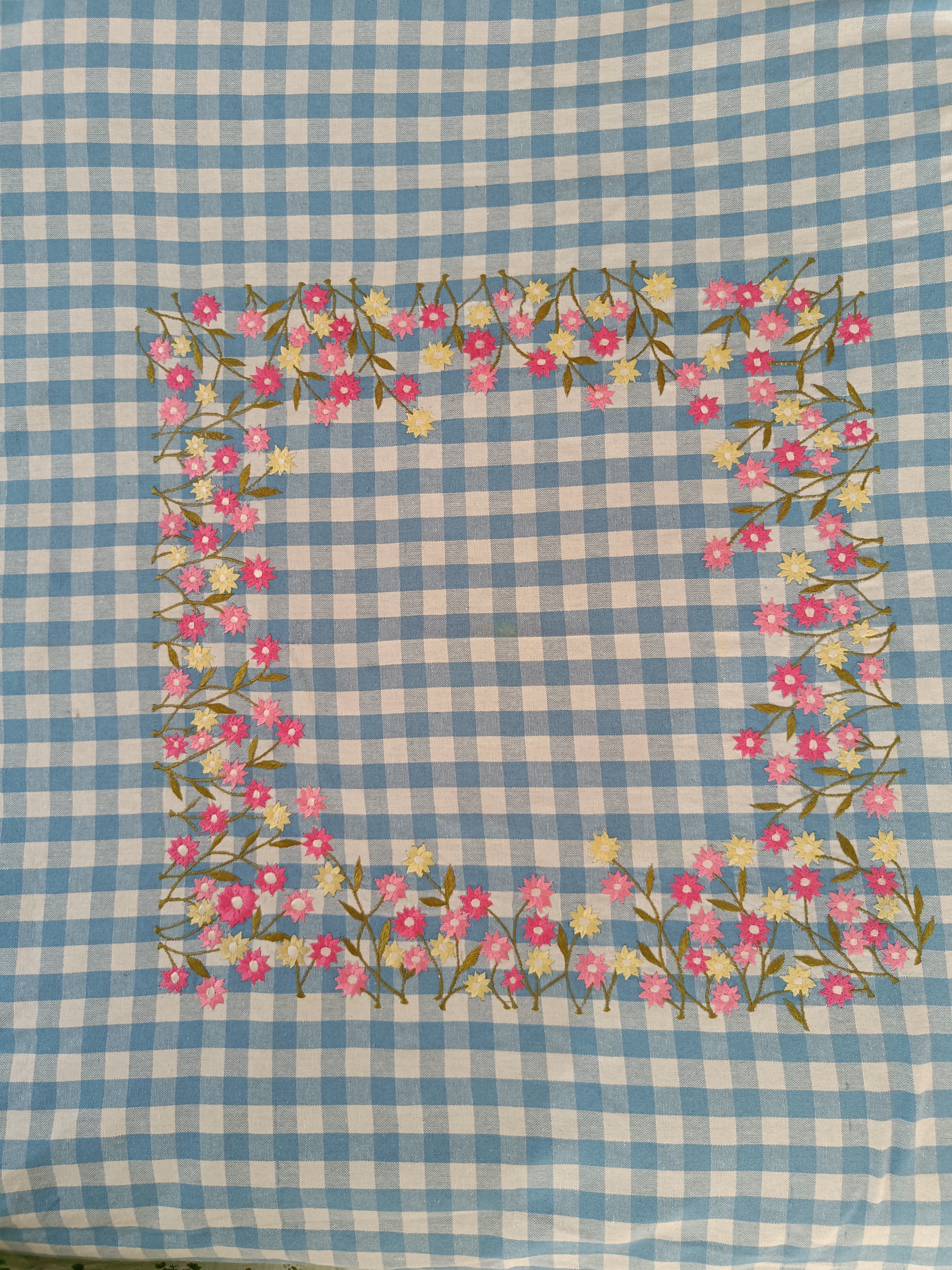 Floral embroidered tablecloth in blue gingham print