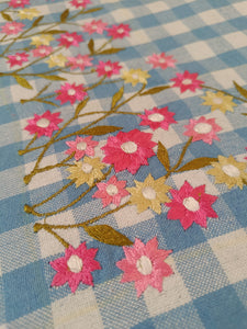 Floral embroidered tablecloth in blue gingham print